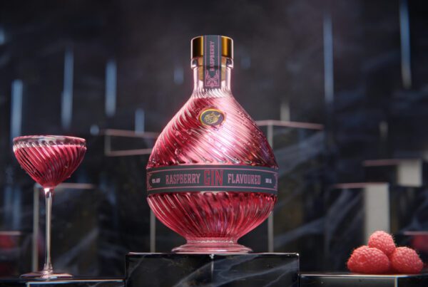 A still image taken from a 3D animation for a Raspberry Gin Showing a Stylish Bottle of Gin, a cocktail glass and some raspberries. Gemaakt door Fictionizer.tv. Een afbeelding uit een 3D Animatie voor een Frambozen Gin. Het laat de fles van de Gin, een cocktailglas en een aantal frambozen zien. Gemaakt door Fictionizer.tv. Fictionizer | 3D Animatie | Animatiestudio | Gin Product Animation